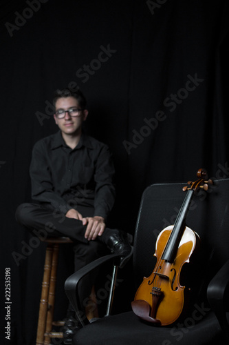 portrait of violinist in studio black background