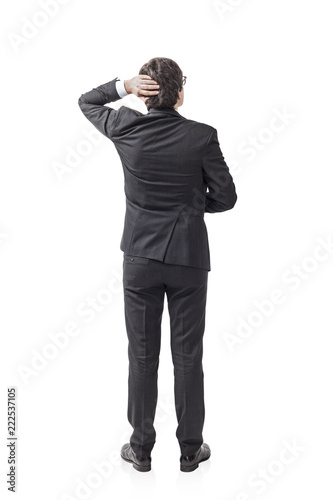 Fotografie Young dark hair businessman looking and thinking