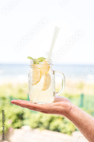 hand holding a cocktail