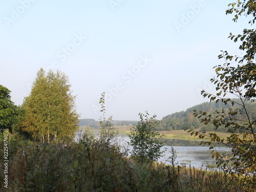 Fototapeta Naklejka Na Ścianę i Meble -  picturesque banks of the river in the autumn evening