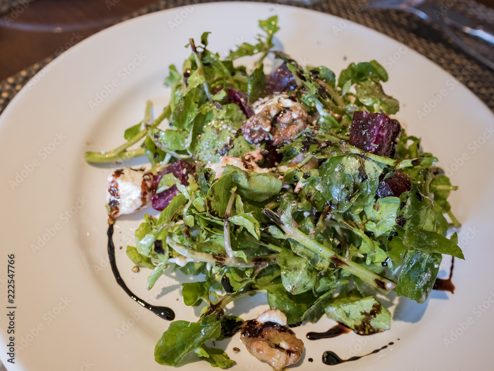 Close up shot of healthy arugula and beets salad