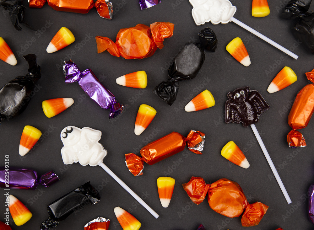 Fototapeta premium Halloween Candy Background on a Black Surface