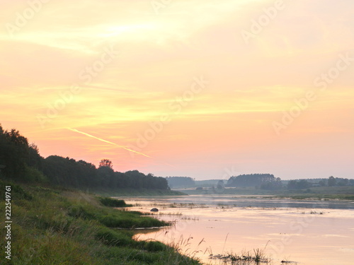 picturesque river bank at sunset