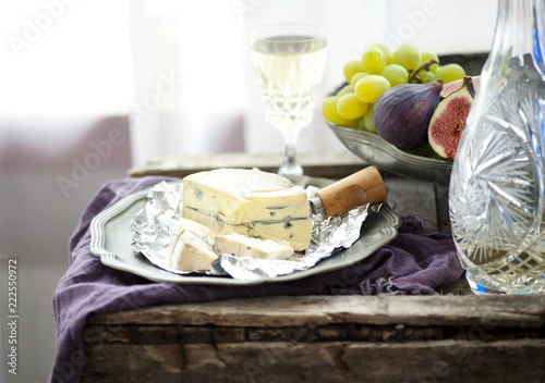 Cambocola cheese with figs, grapes and white wine photo