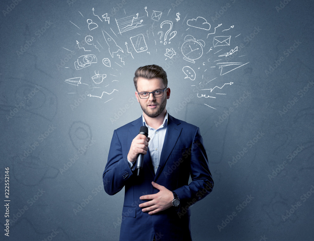 Businessman speaking into microphone with mixed doodles over his head Businessman speaking into microphone with mixed doodles over his head