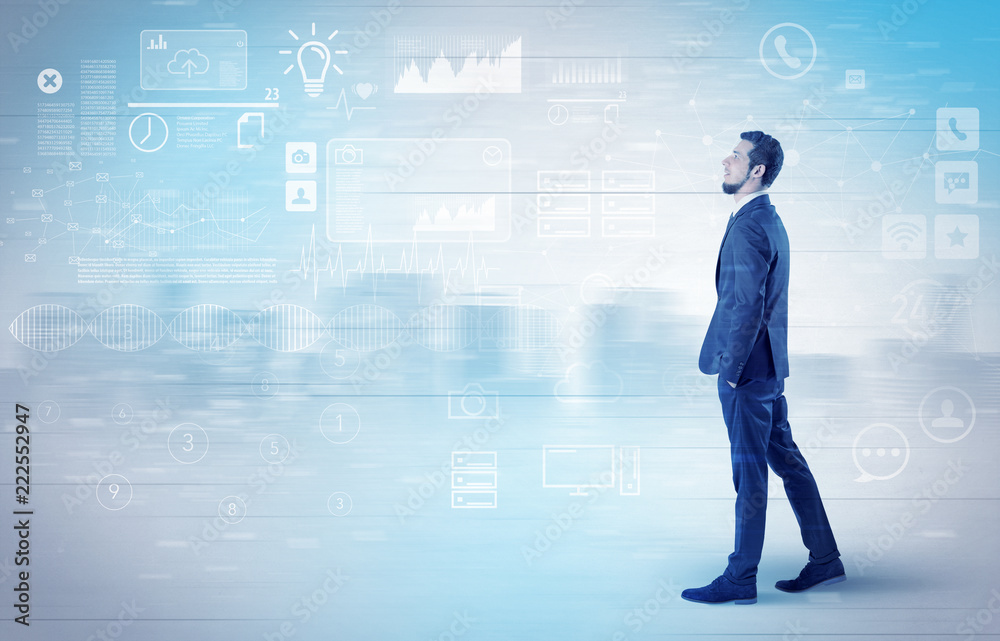 Handsome businessman walking in suit with briefcase on his hand and database concept around
Handsome businessman walking in suit with briefcase on his hand and database concept around