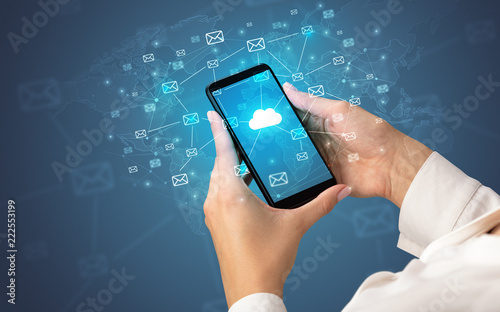 Female hand using smartphone with cloud, message and global concept 