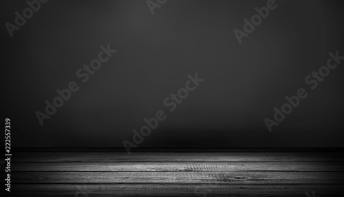 Dark table on black background.