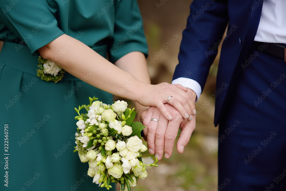 Bride and groom's hands with wedding rings Bride and groom's hands with wedding rings