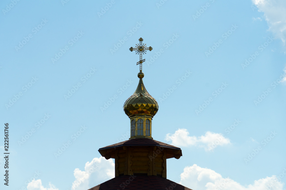 Dome with a cross on the Church against the sky. Dome with a cross on the Church against the sky.