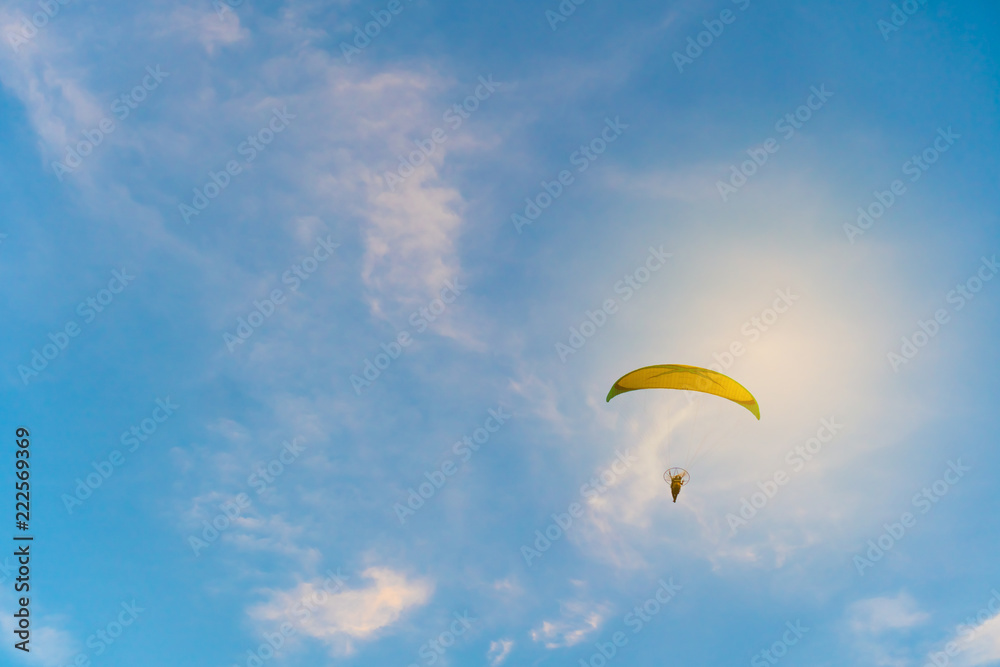 Man is riding para motor in beautiful sunset cloud sky background. Man is riding para motor in beautiful sunset cloud sky background.