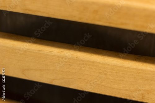 The wooden wall of yellow color is made of profile strip