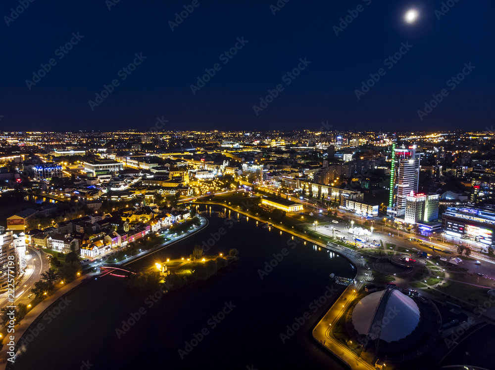 Minsk cityscape at night. Illumination of modern city buildings, aerial top view