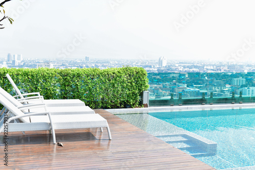 Swimming pool on roof top with beautiful city view at bangkok  thailand.