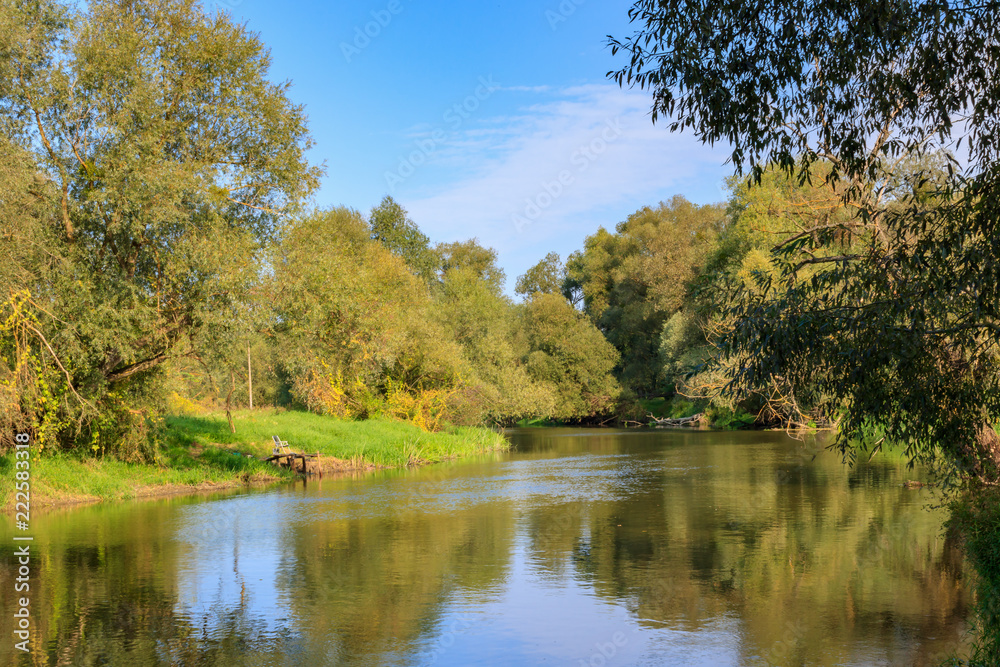 River landscape on a background of blue sky at sunny autumn morning