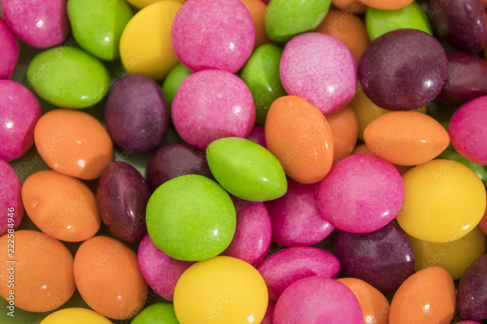 Many colored candies in a background composition Many colored candies in a background composition