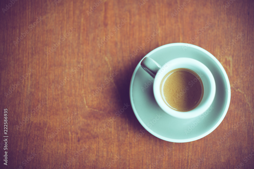 cup of espresso coffee on dark brown wood background with copy space on left cup of espresso coffee on dark brown wood background with copy space on left