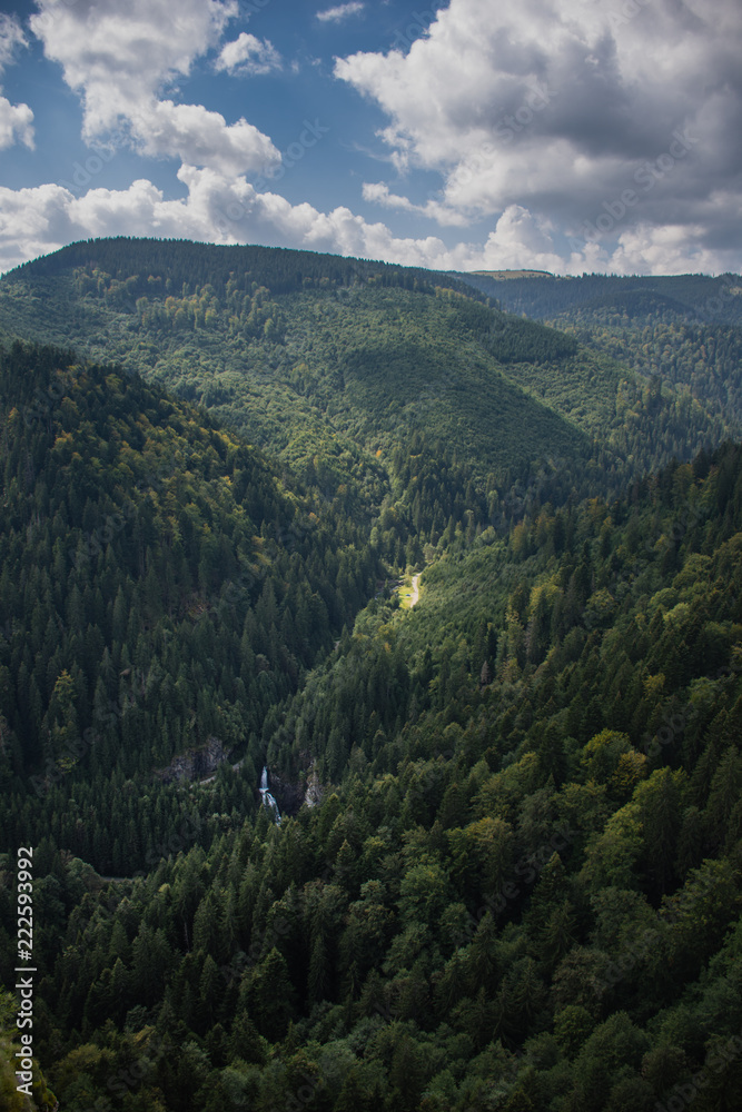 Waterfall in valley; Western Carpathians, Romania