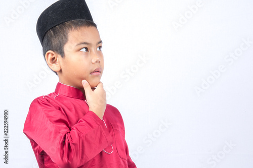 Potrait of young asian muslim boy/girl isolated on white background. photo