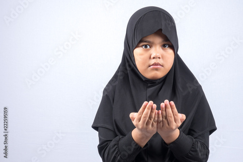 Potrait of young asian muslim boy/girl isolated on white background. photo