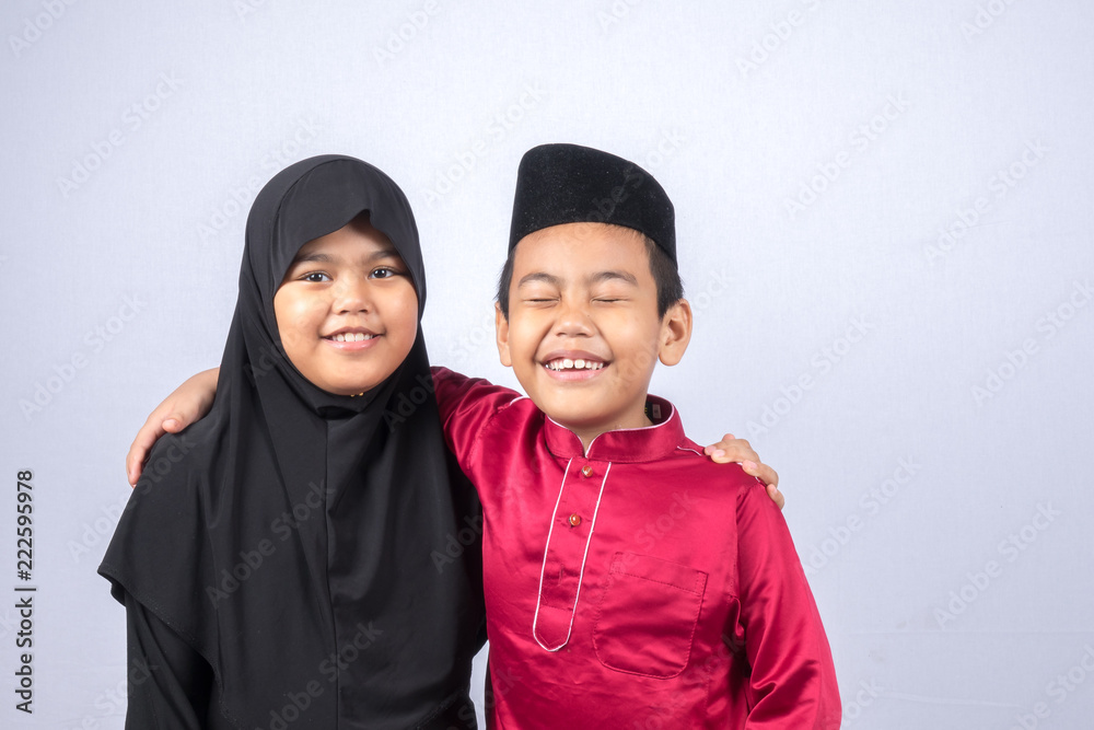 Potrait of young asian muslim boy/girl isolated on white background. Potrait of young asian muslim boy/girl isolated on white background.