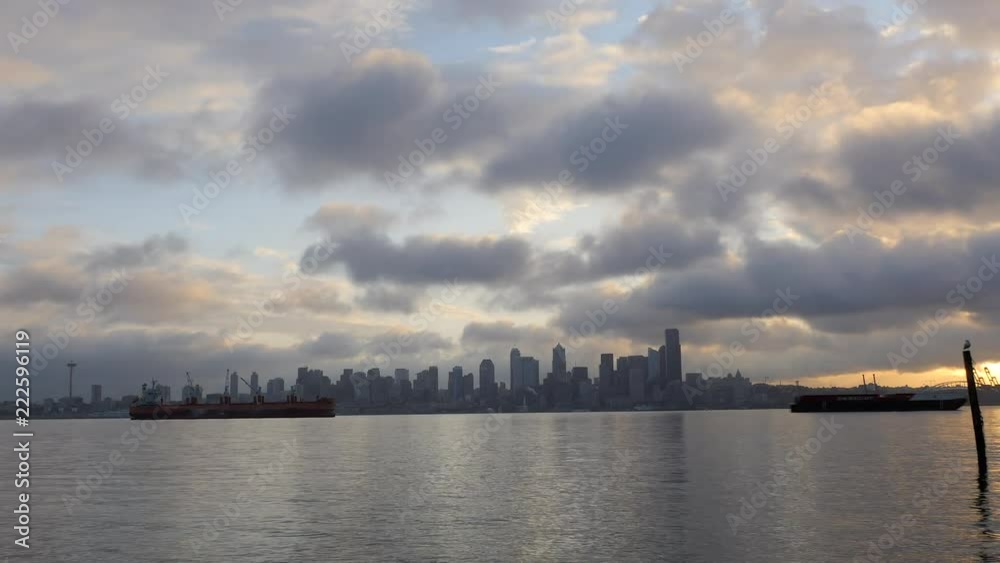 Time Lapse of Cloudy Sunrise Looking at Downtown Seattle Skyline Time Lapse of Cloudy Sunrise Looking at Downtown Seattle Skyline