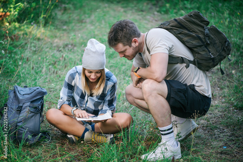 Hiking couple with map