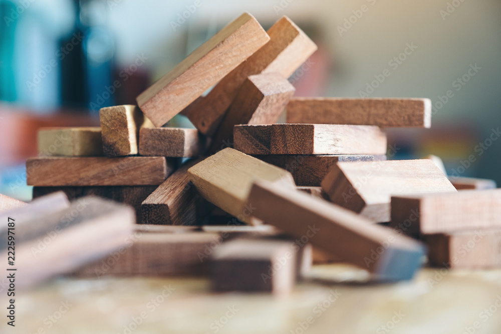 Closeup image of wooden blocks of Jenga or Tumble tower game Closeup image of wooden blocks of Jenga or Tumble tower game
