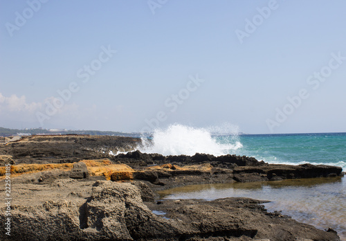 Beautiful seascape with waves crashing against rocks