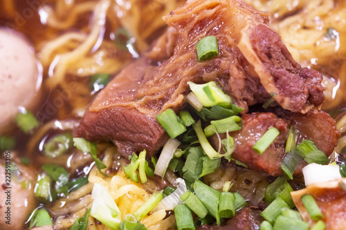 Closeup of Asian Style beef noodles with soup.