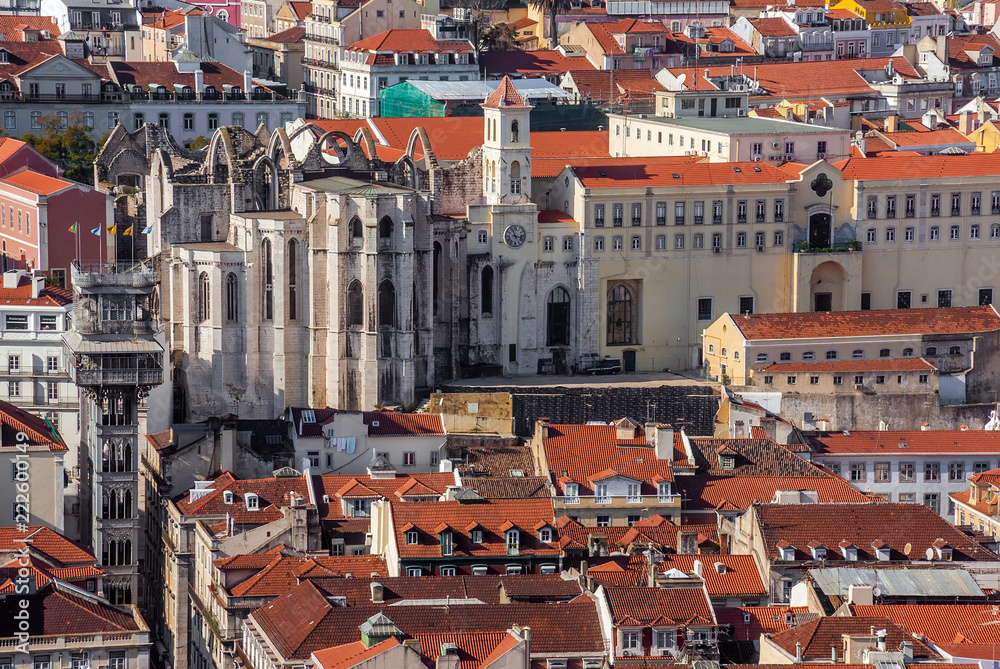 Carmo Convent ruins, Santa Justa lift or Elevator and orange rooftops of the historical Baixa District of Lisbon, Portugal.