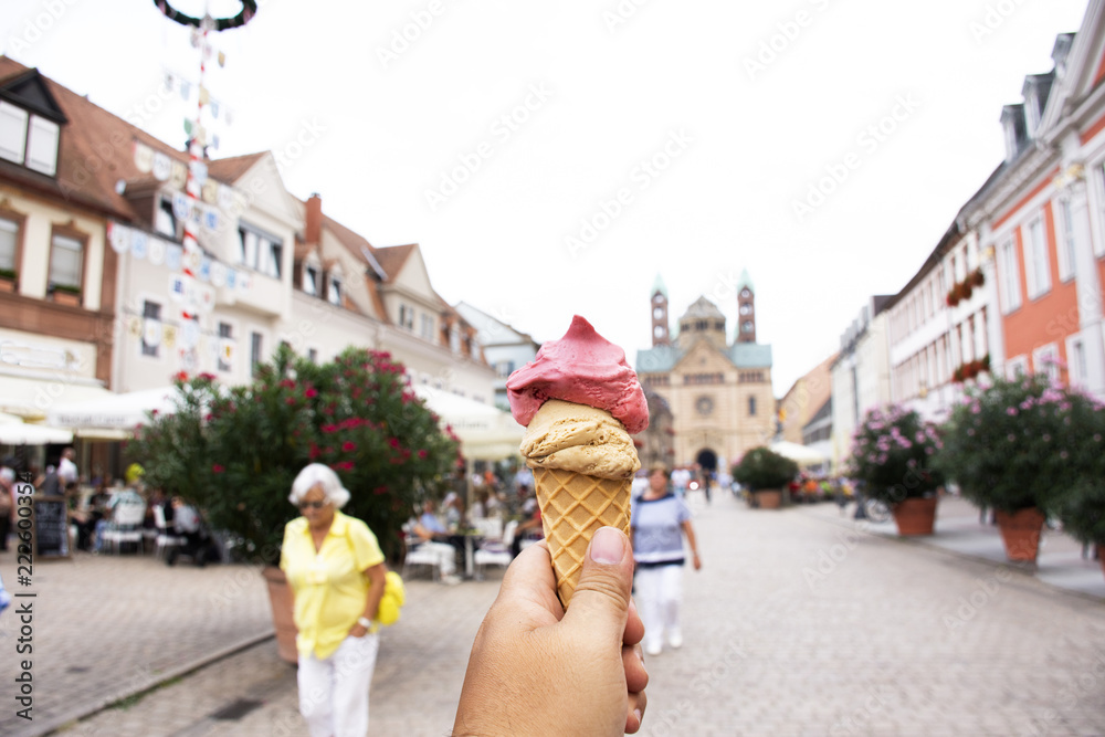 Thai woman show ice cream and eating on the road after travel visited Speyer town in Rhineland Palatinate, Germany