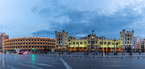 North Station most important train station in Valencia rail transport, Estacion del Norte Spain wide angle, city lights lighting, night view panorama with the bullring