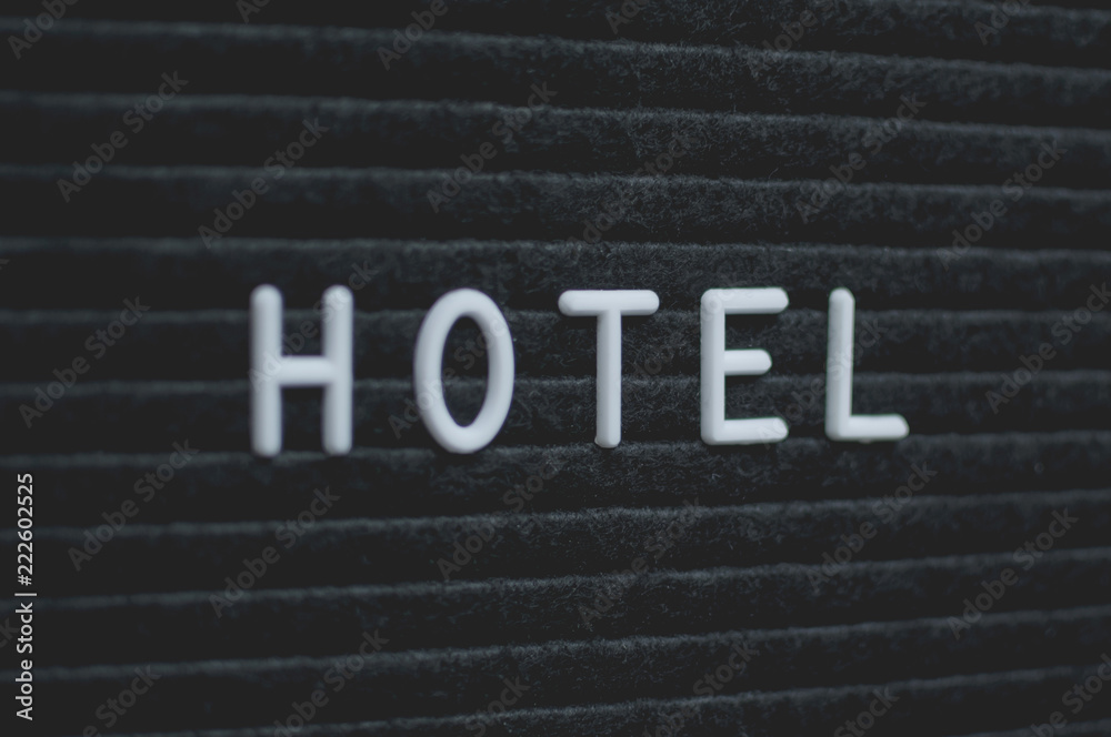 Word hotel written on the letter board. White letters on the black background. Business concept Word hotel written on the letter board. White letters on the black background. Business concept