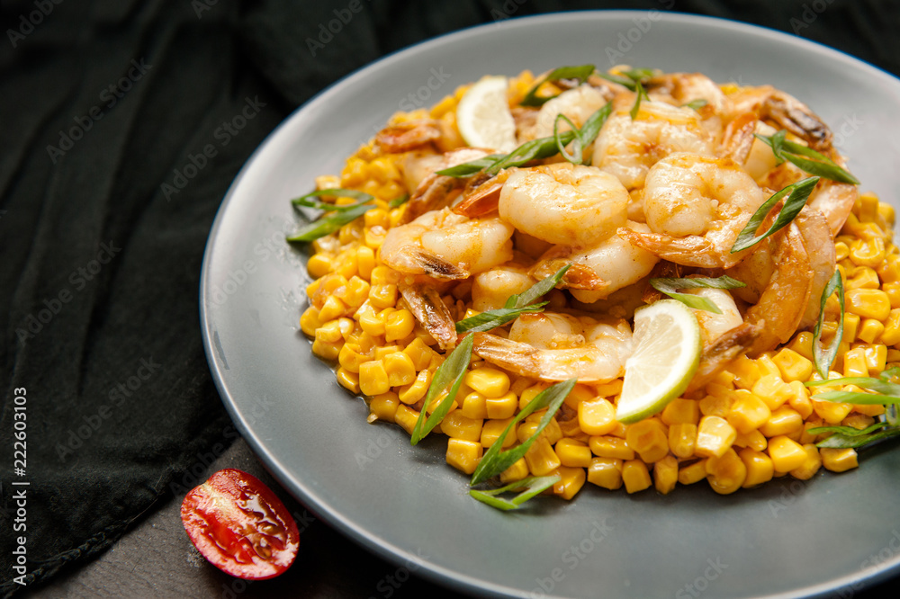 Grilled king prawns on dark plate Grilled king prawns on dark plate