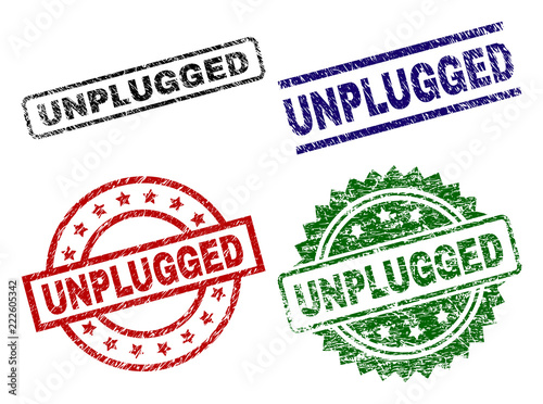 UNPLUGGED seal stamps with corroded texture. Black, green,red,blue vector rubber prints of UNPLUGGED caption with corroded style. Rubber seals with round, rectangle, medal shapes.