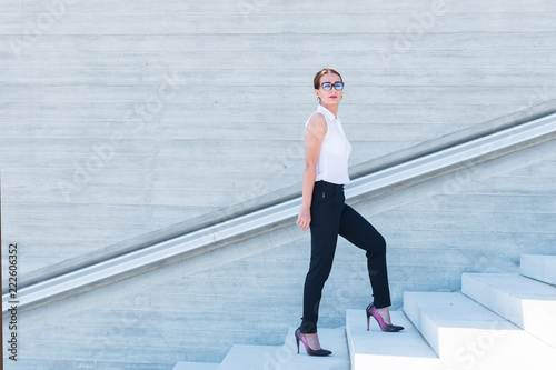 business woman climbs the stairs