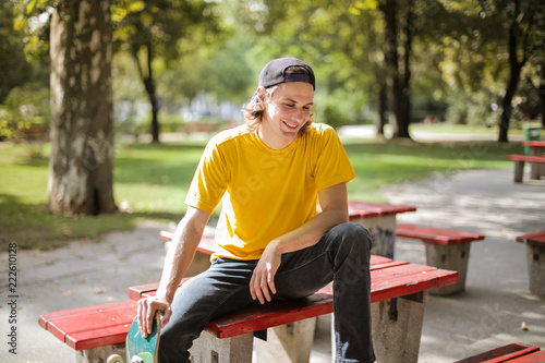 Young man hanging out in a park. photo