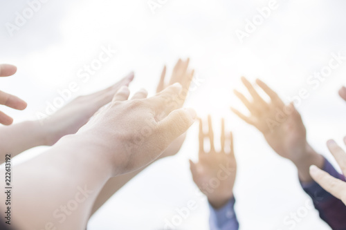 Team work concept, group of hand raise and show on sky