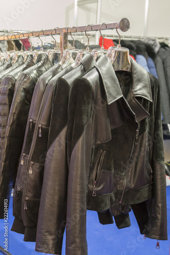 Leather jackets on the hangers at the store. Various leather jackets on the hangers at the store. vertical photo