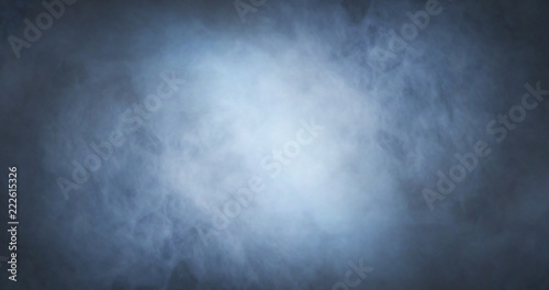 Abstract smoke texture over black background. Fog in the darkness.