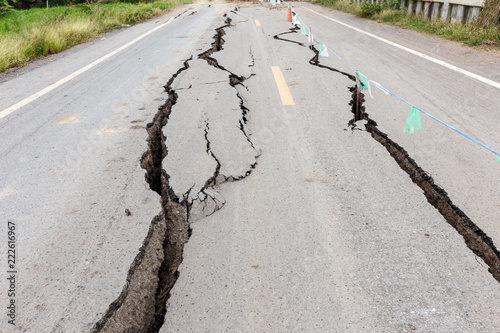Cracked and broken asphalt Road.