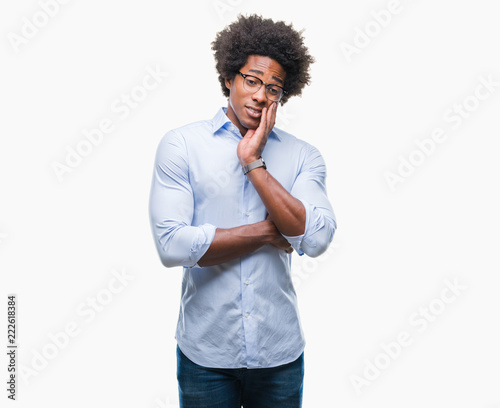 Afro american business man wearing glasses over isolated background thinking looking tired and bored with depression problems with crossed arms.