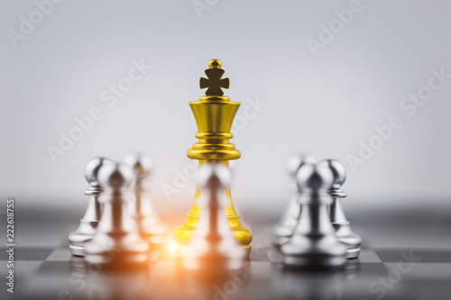 Gold king in chess game with Concept for company strategy business victory or decision the path to success.