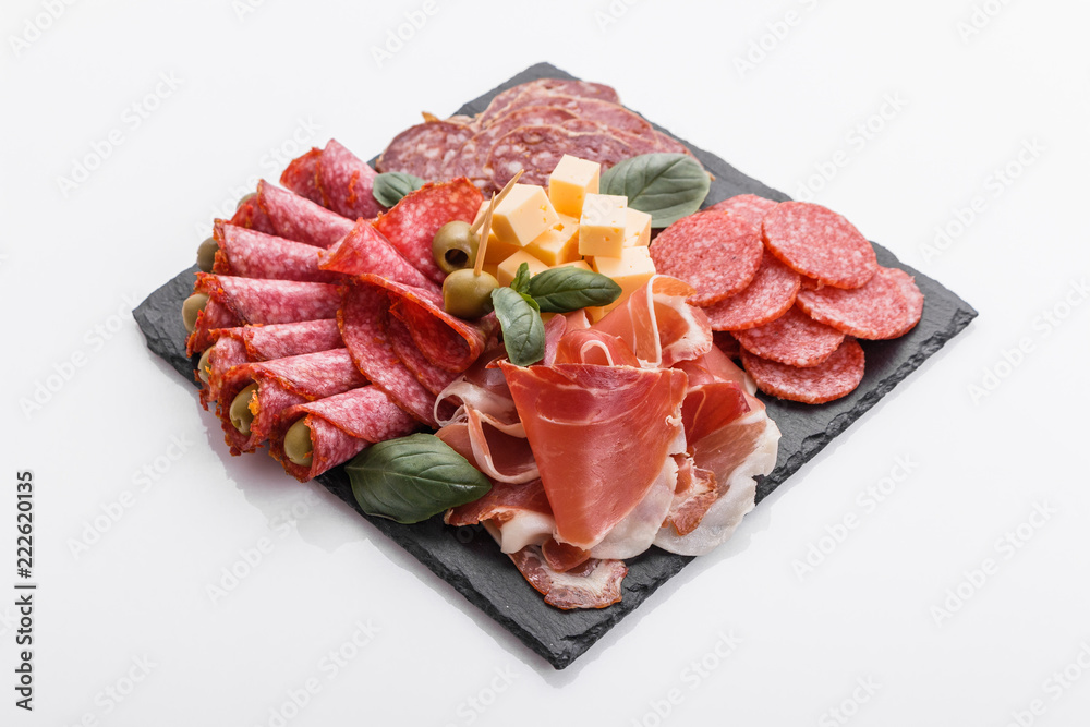 Cold smoked meat plate on a white background Cold smoked meat plate on a white background
