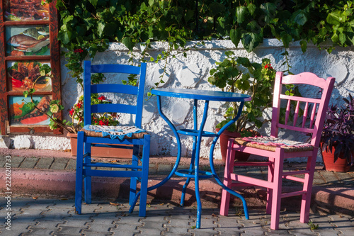 old chairs and table in greek still