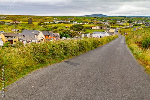 Doolin village with houses and farm fields photo