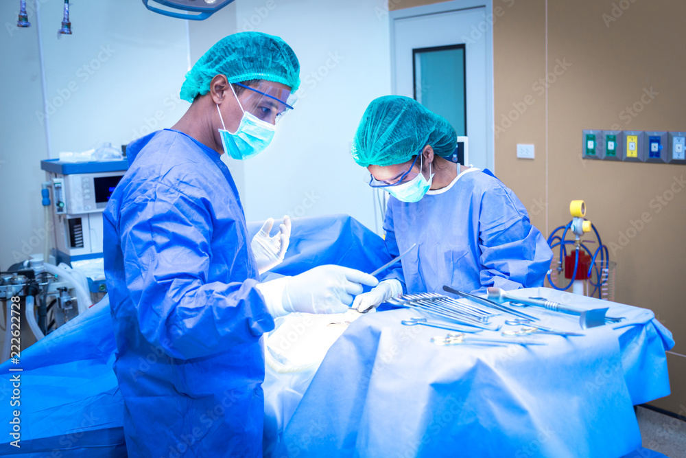 Team surgeon at work in operating room. Team surgeon at work in operating room.
