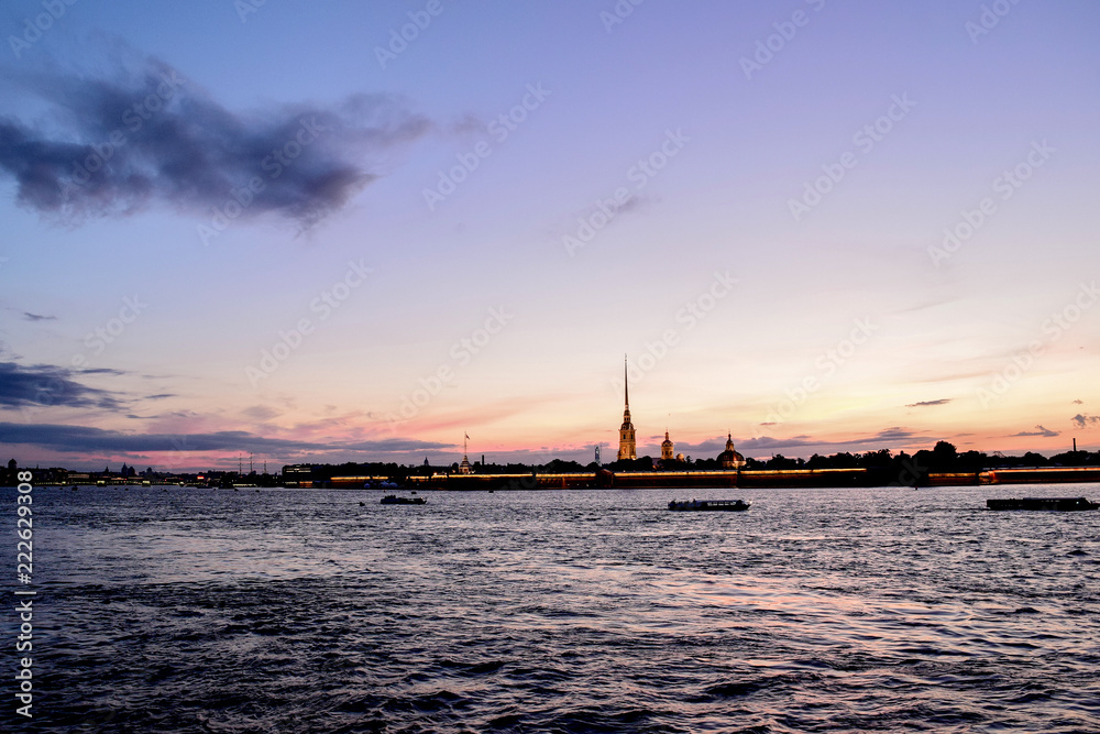 Panoramic view of Peter and Paul Fortress and Neva river on the sunset and beautiful sky above