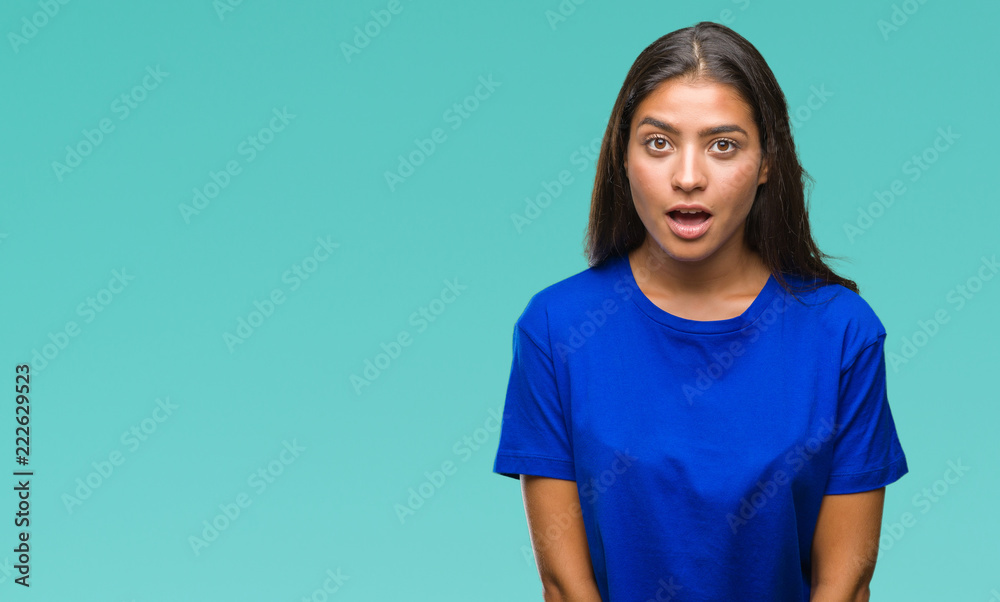 Young beautiful arab woman over isolated background afraid and shocked with surprise expression, fear and excited face. Young beautiful arab woman over isolated background afraid and shocked with surprise expression, fear and excited face.